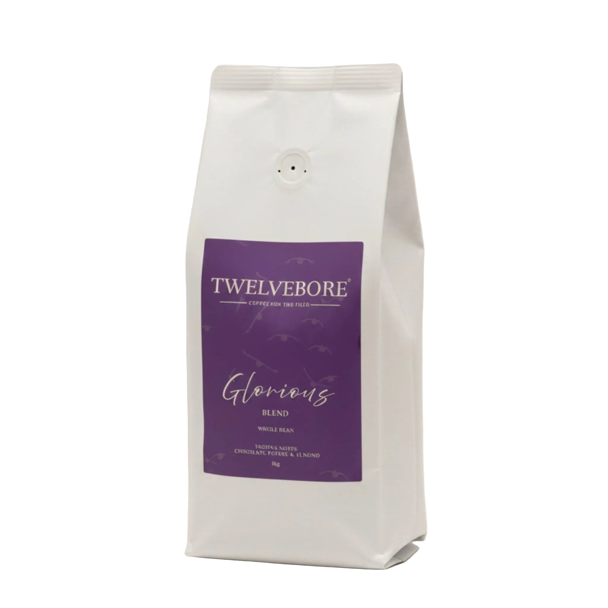 A flat product label or package design for Twelve Bore Coffee for the Field's 'Glorious Blend' whole bean coffee, featuring a solid purple background with cream-colored text and faint bird silhouettes.